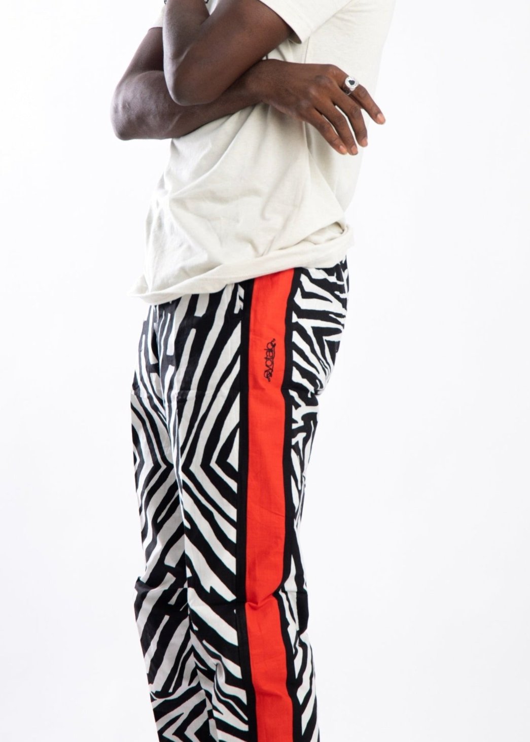 Zebra style pants with contrast red side strip